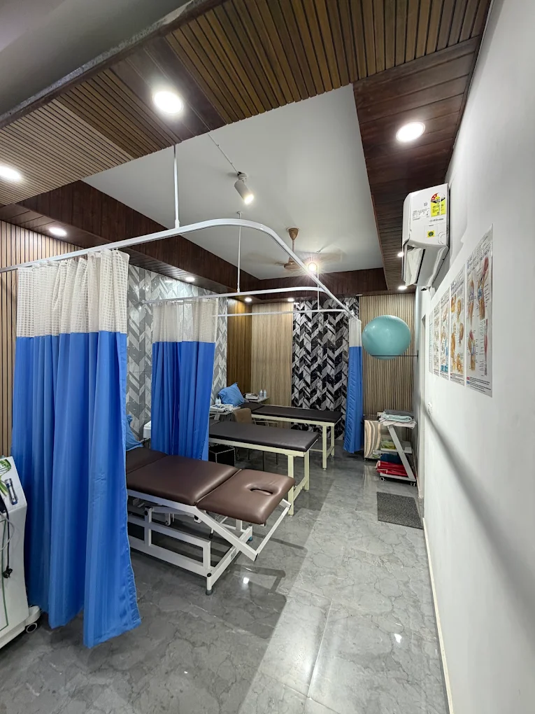 PhysioSewa exercise and rehabilitation area with parallel bars, therapy balls and resistance bands